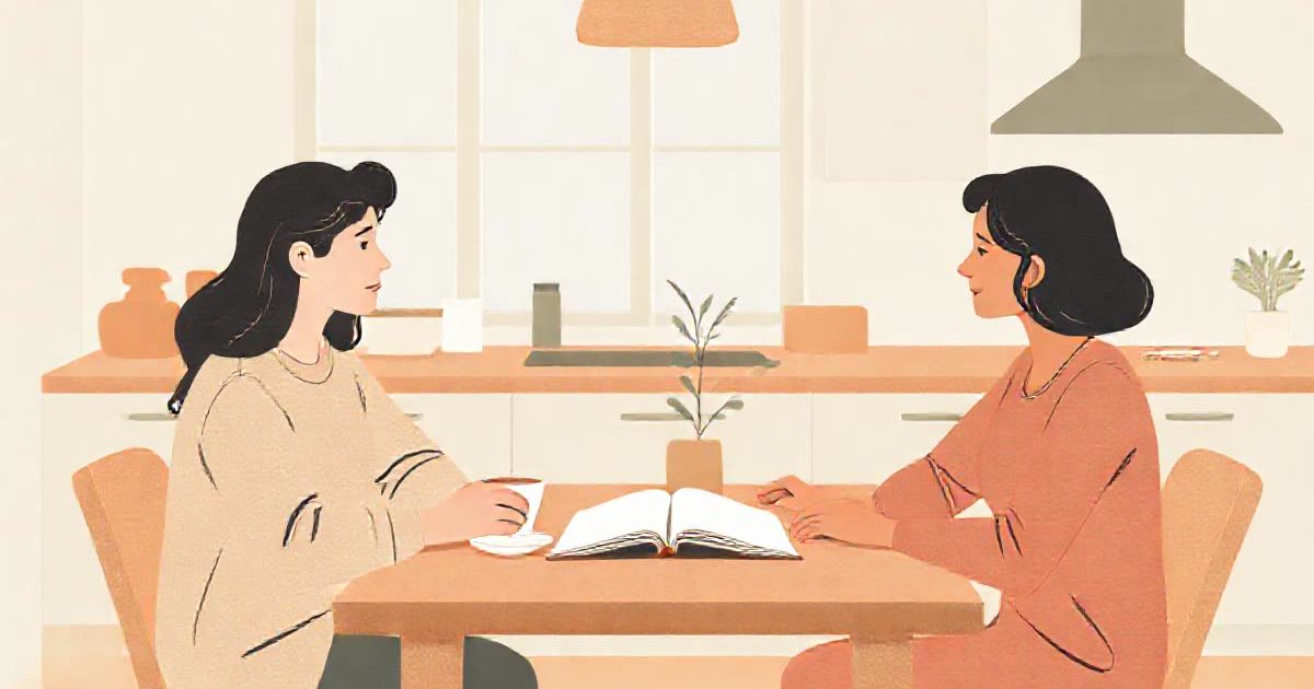 A calm conversation between two people at a kitchen table with tea, an open notebook between them.