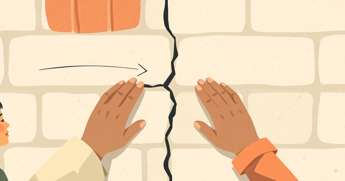 A small crack in a wall being repaired by two pairs of hands.